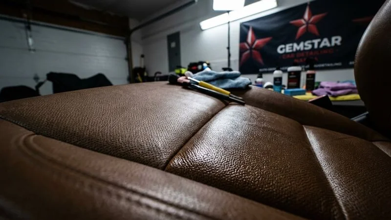 Freshly detailed leather car seats close up